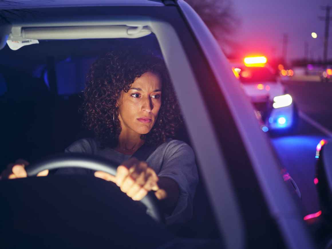 woman stopped by police car